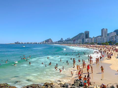 A beach in Rio de Janeiro with waves and coastline